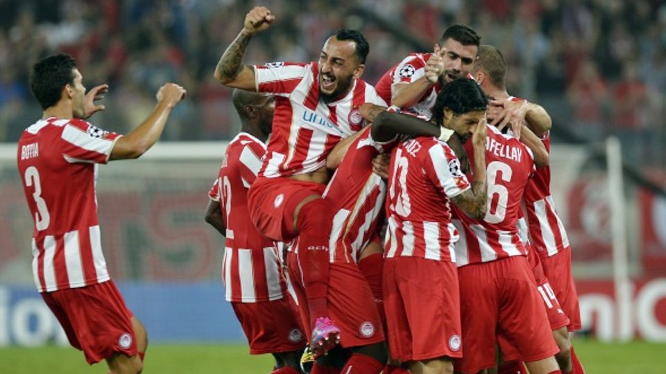 Pemain Olympiakos saat berselebrasi. Copyright: © GETTY IMAGES